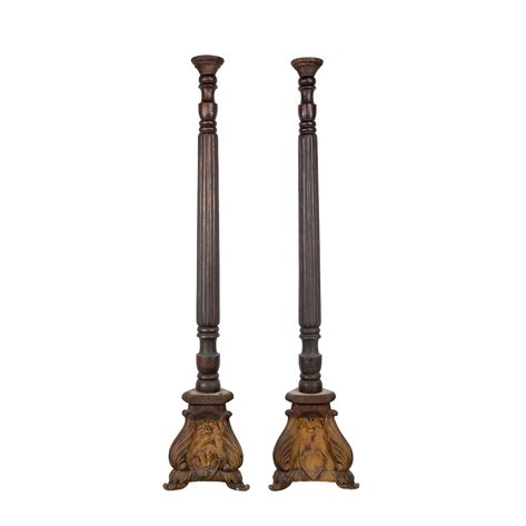 A pair of church style blandones (candlesticks) with fluted baluster shafts and acanthus-carved triangular scroll bases