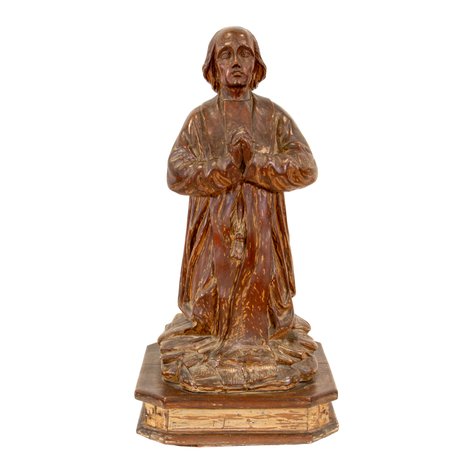 A classical style image of St. John Mary Vianney in genuflection