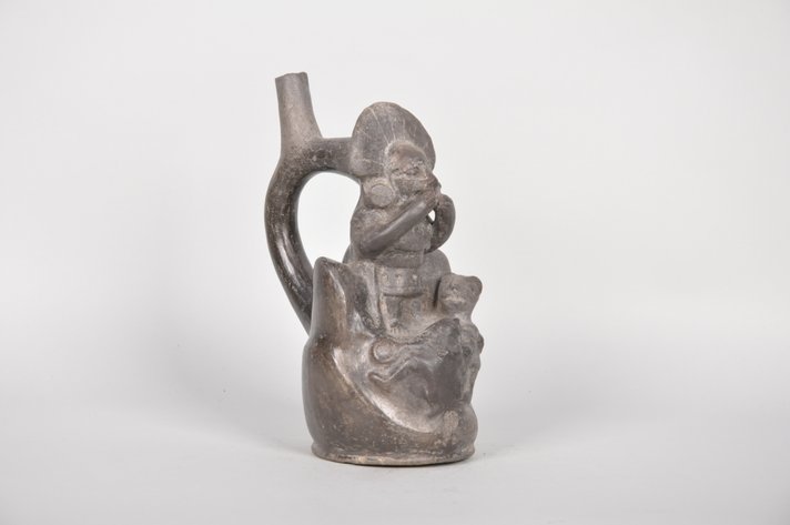 A Black Moche Stirrup Spout Multi-Figural Bottle
