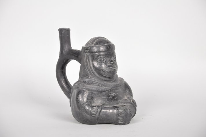 A Black Moche Stirrup Spout Figural Bottle