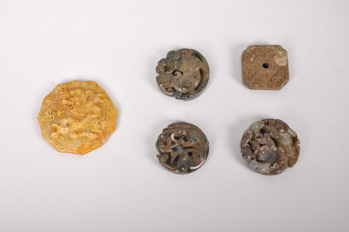 Five Carved Jade Pendants or Amulets