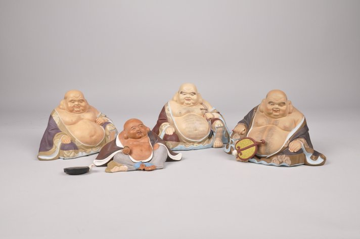 Four Japanese Hakata Seated Buddha Dolls