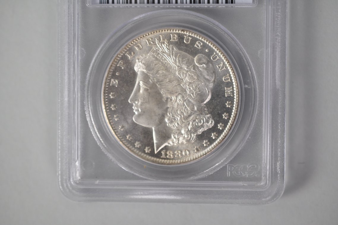 Graded and Slabbed Mint Condition Morgan Silver Dollar, photo 2 of 8
