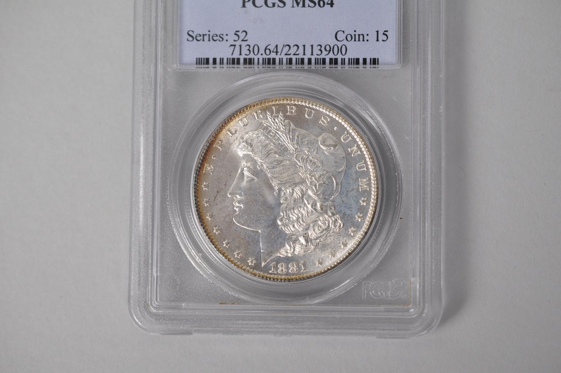 Graded and Slabbed Mint Condition Morgan Silver Dollar, photo 2 of 7