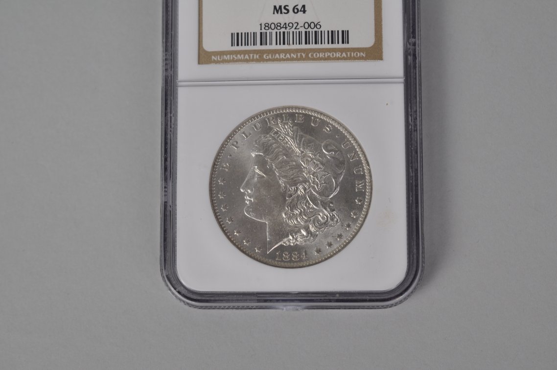 Graded and Slabbed Mint Condition Morgan Silver Dollar, photo 2 of 7