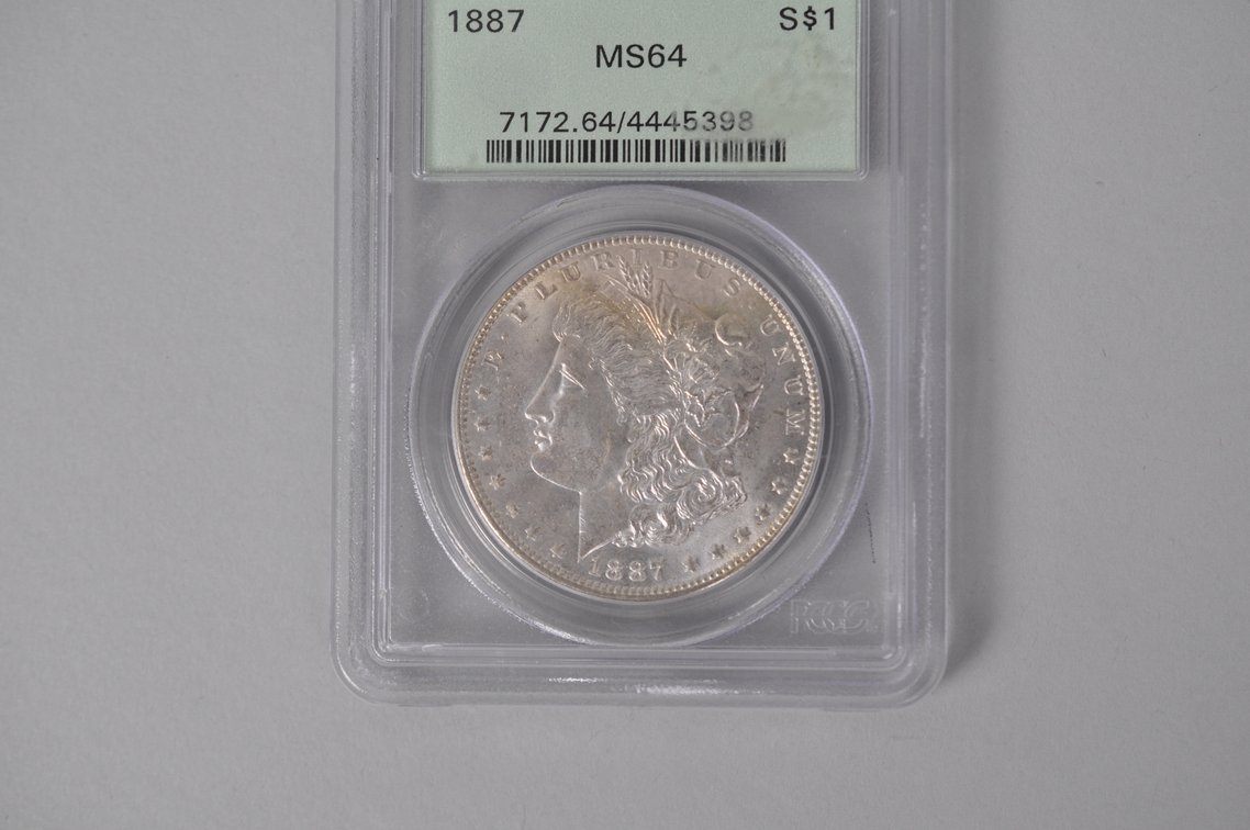 Graded and Slabbed Mint Condition Morgan Silver Dollar, photo 2 of 6
