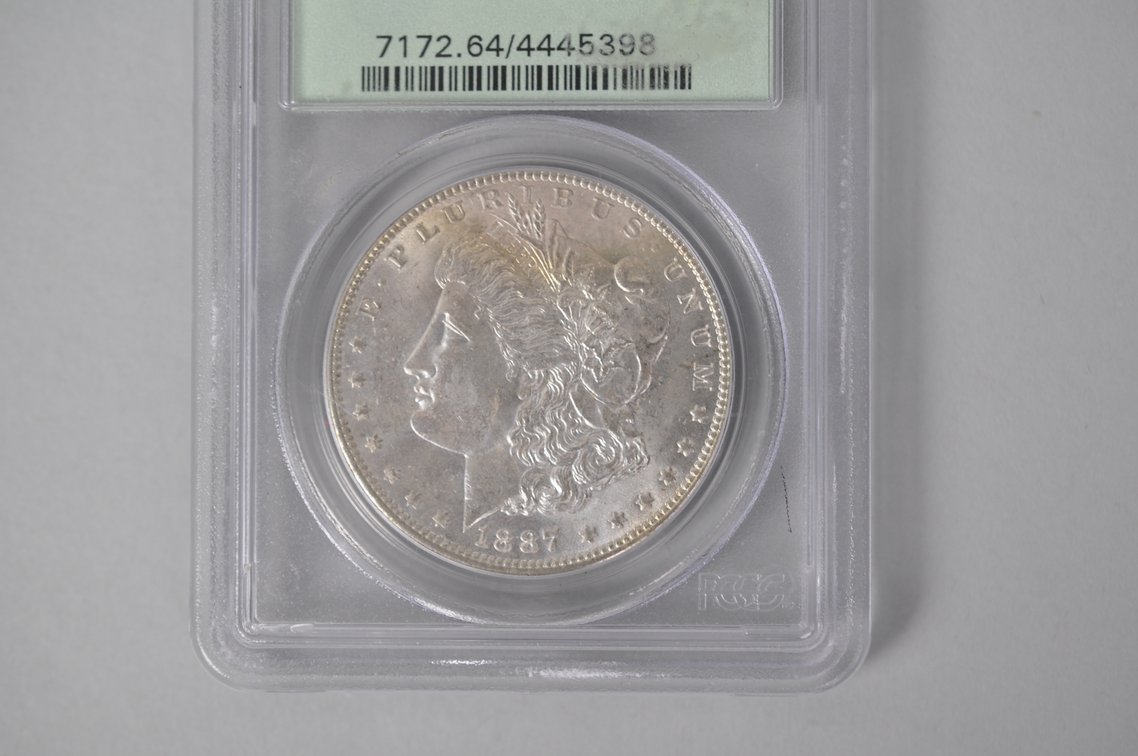 Graded and Slabbed Mint Condition Morgan Silver Dollar, photo 3 of 6
