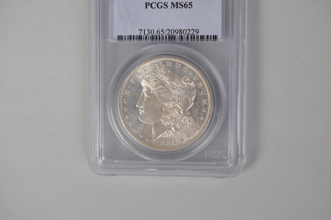 Graded and Slabbed Mint Condition Morgan Silver Dollar, photo 2 of 6