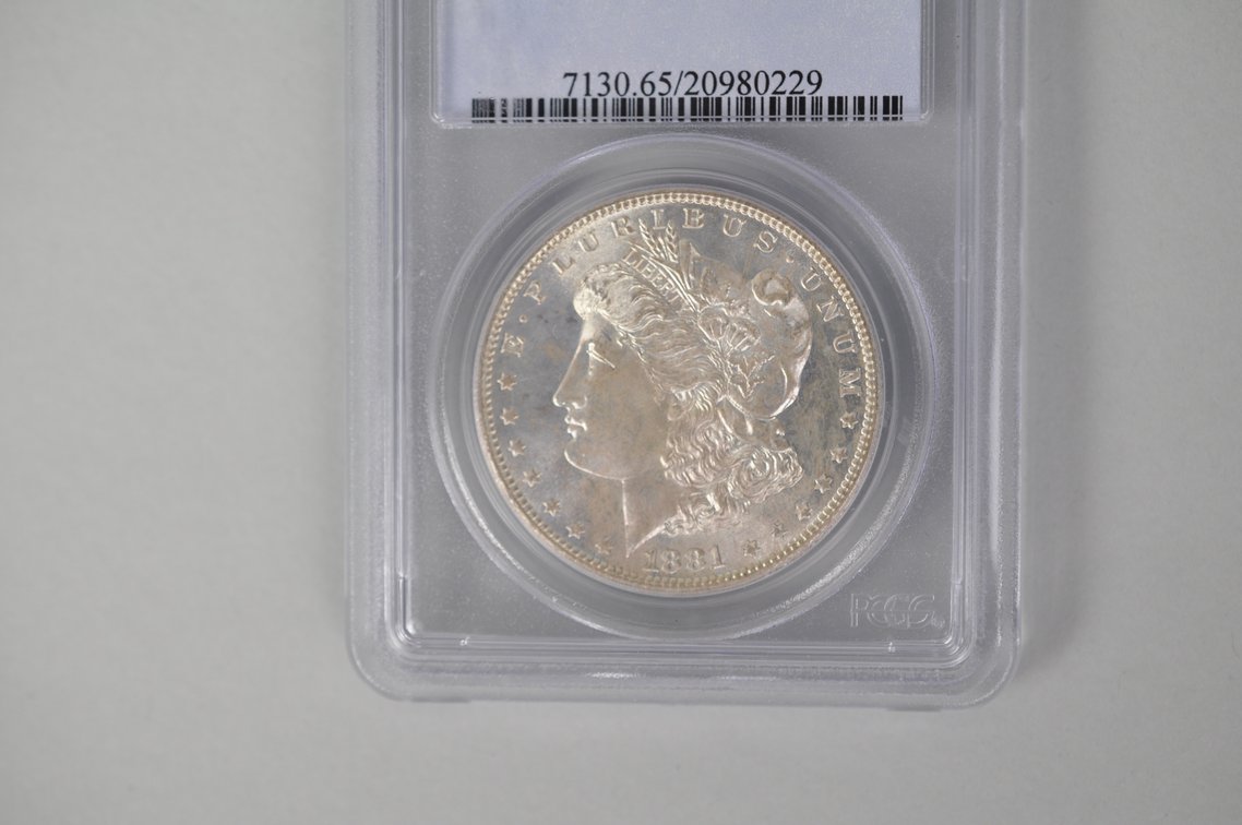 Graded and Slabbed Mint Condition Morgan Silver Dollar, photo 3 of 6