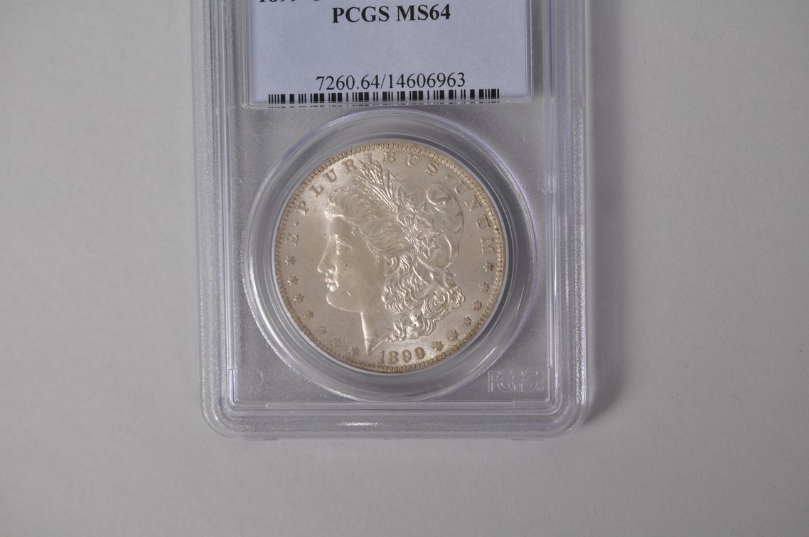Graded and Slabbed Mint Condition Morgan Silver Dollar, photo 2 of 6