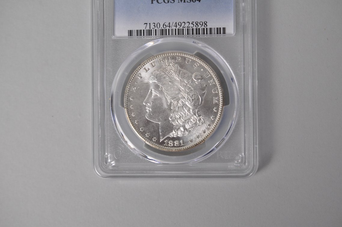 Graded and Slabbed Mint Condition Morgan Silver Dollar, photo 2 of 5