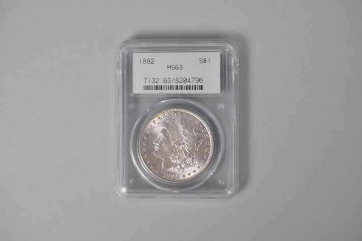 Graded and Slabbed Mint Condition 1882 Morgan Silver Dollar