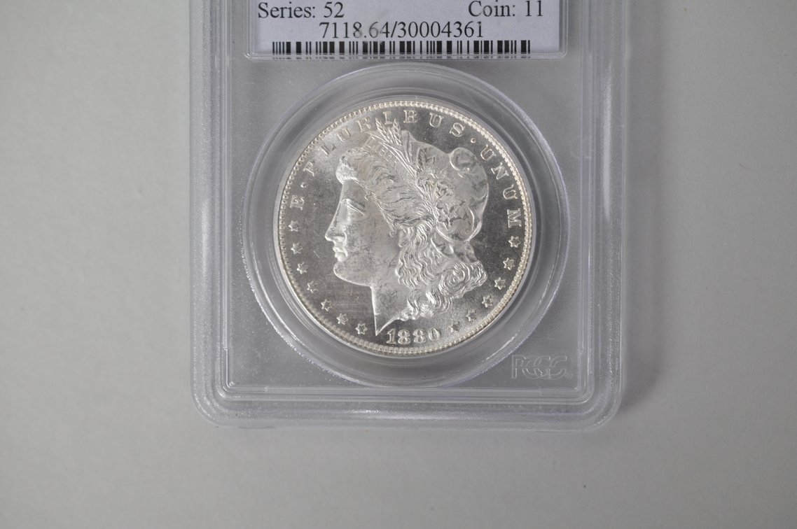 Graded and Slabbed Mint Condition Morgan Silver Dollar, photo 2 of 6