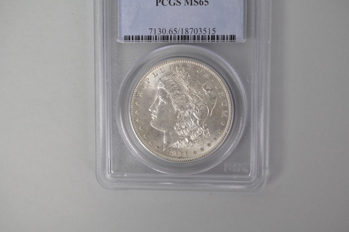 Graded and Slabbed Mint Condition Morgan Silver Dollar, photo 2 of 6