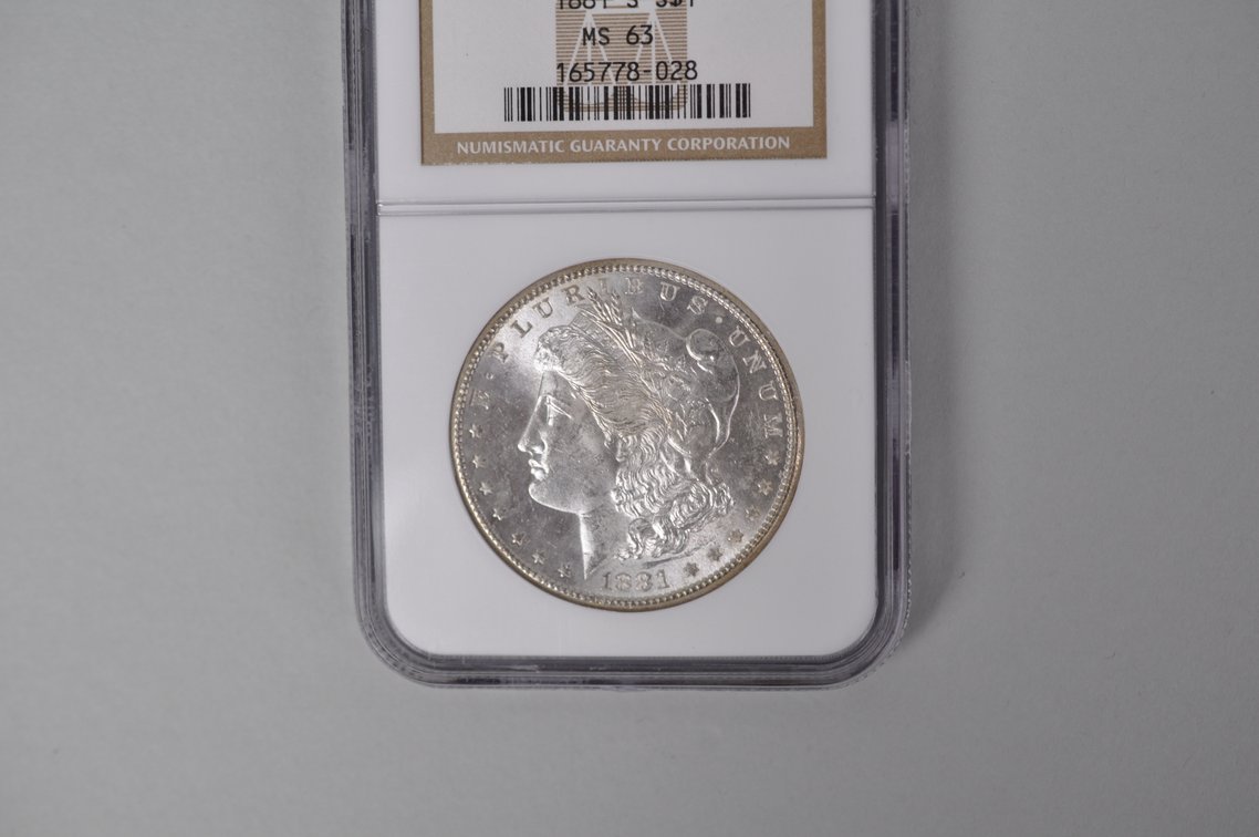 Graded and Slabbed Mint Condition 1881 Morgan Silver Dollar, photo 2 of 5