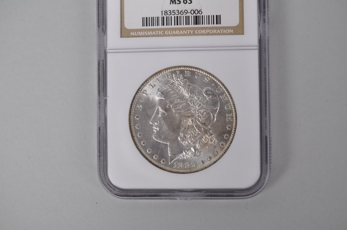 Graded and Slabbed Mint Condition Morgan Silver Dollar, photo 2 of 4