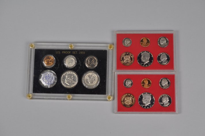 Two 1982 Proof Sets in Red Holders and 1959 Proof Set in Case