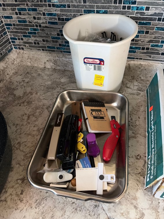 Pan of misc;  trash can of misc