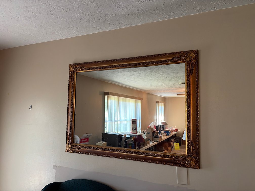 +\- 48x34” guilt framed mirror