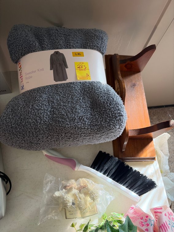 Sweater knit; angle figurine; brush; shelf; basket