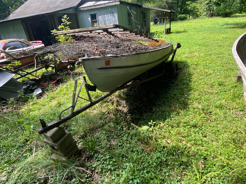 + - 11 FT BOAT W/TRAILER