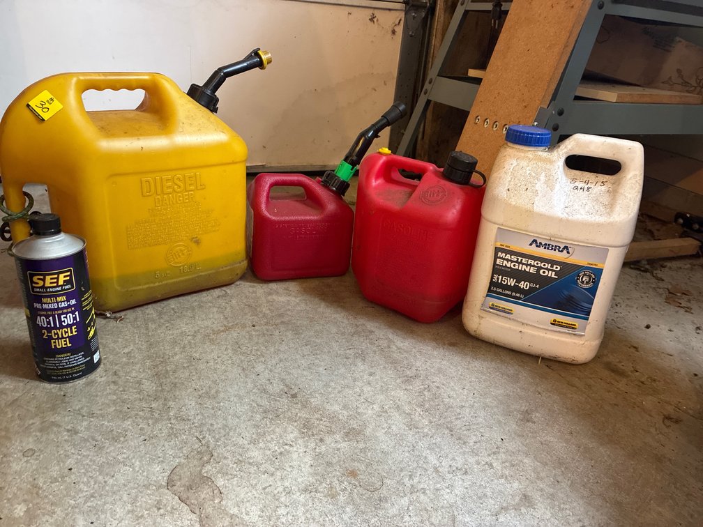 3 Plastic cans- 1 diesel, 2 gas
