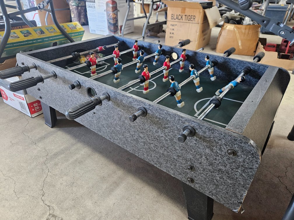 Foosball table and extra balls