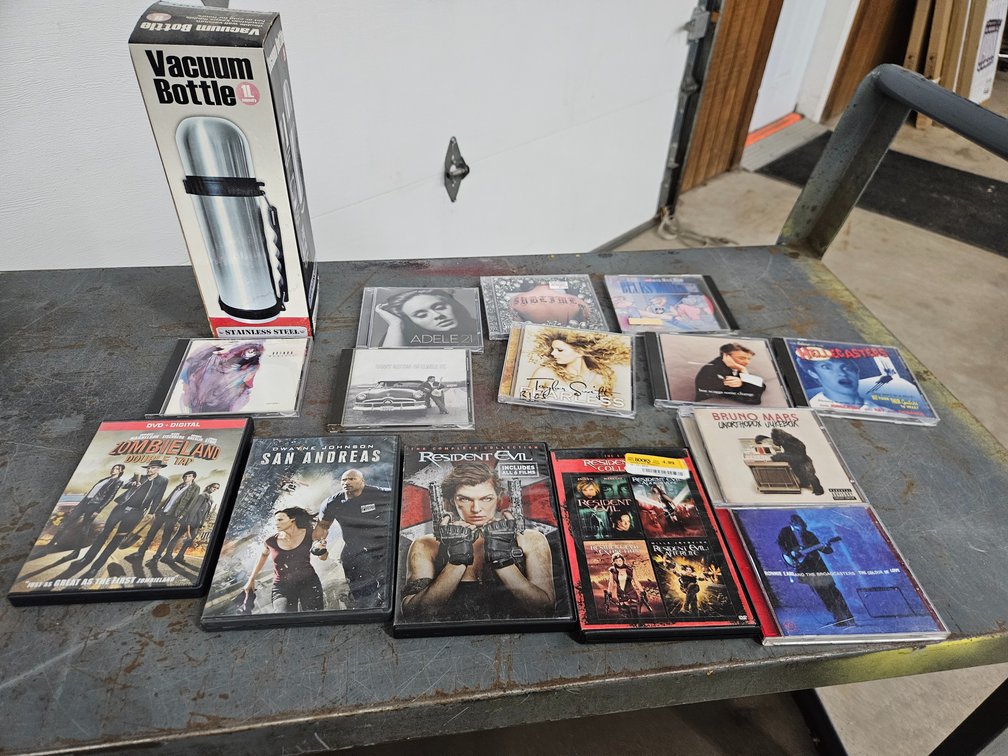 Assorted DVD's and CD's and vacuum bottle
