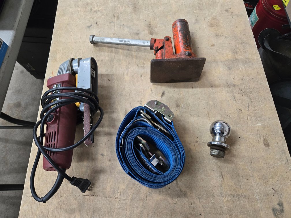 Bottle jack, electric belt sander, tie down strap, 1 7/8" ball