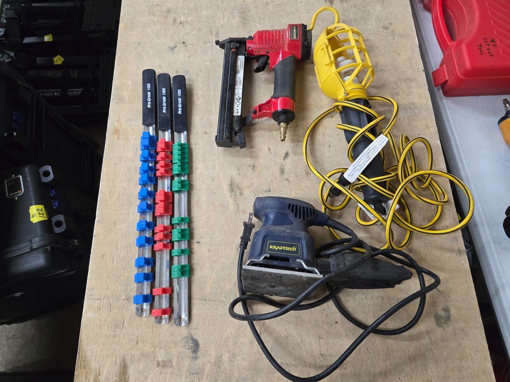 Palm sander, air nail gun, shop light, socket holders