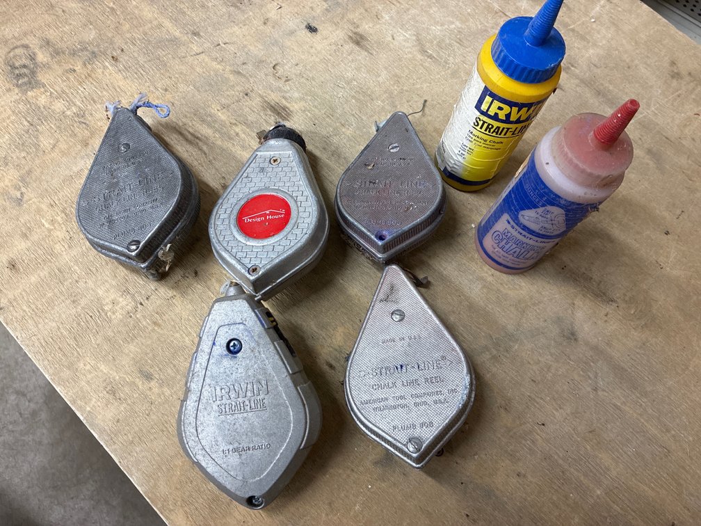 5 String lines with 2 partial bottles of caulk