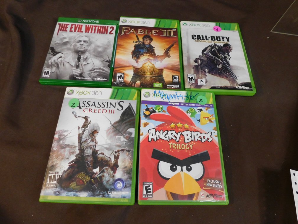 Four XBOX 360 Games, Angry Birds, Assassin's Creed III, Call of Duty, Fable III, XBOX One Game, The Evil Within 2
