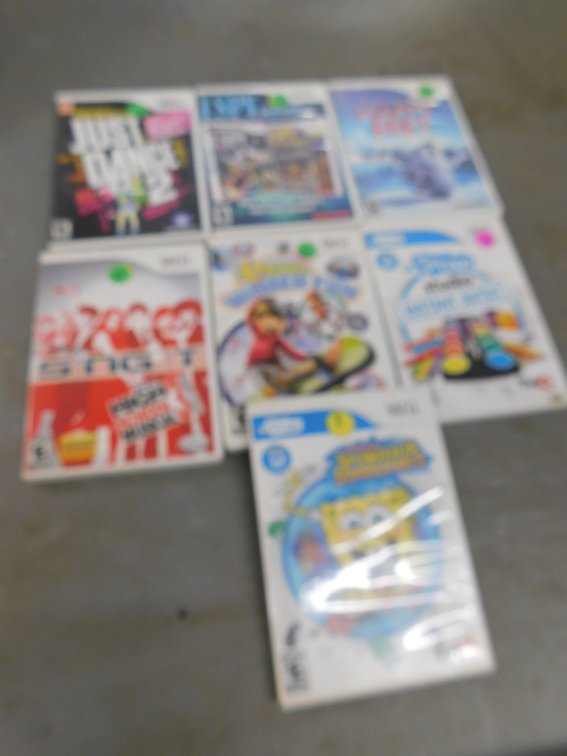 Seven Wii Games, Just Dance 2, Happy Feet, I Spy Game Pack, Disney Sing It, SpongeBob Squigglepants, Instant Artist, Winter Fun