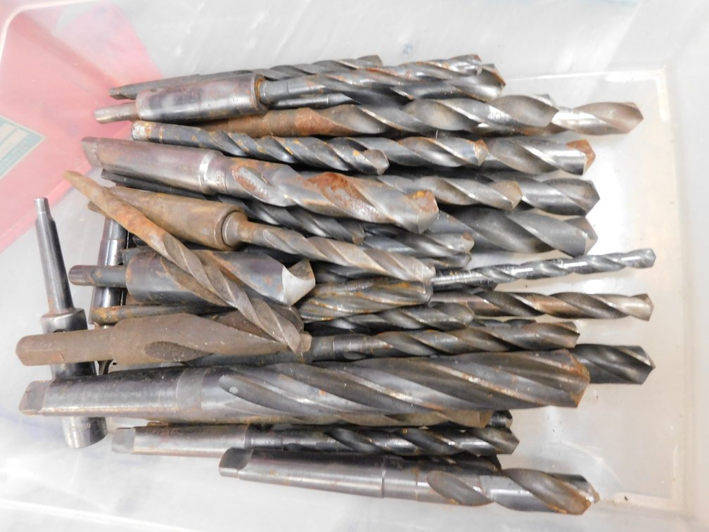 Assorted large drill bits in flat