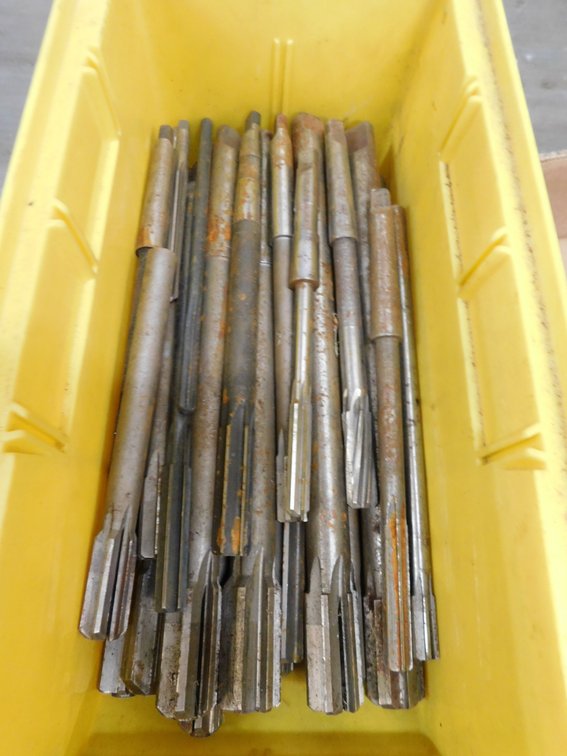 Assorted size reamers in plastic bin
