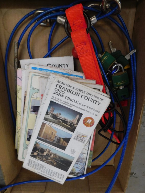 Lot of assorted county maps, cables, locks, etc. in flat