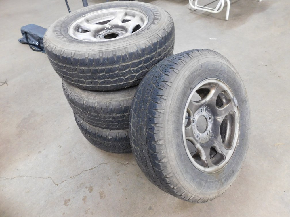 Four Used Goodyear P235/70R16 Tires