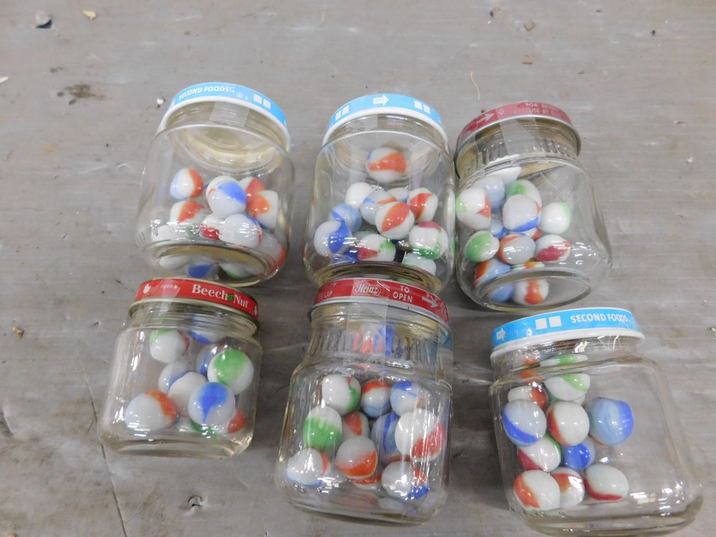 Six Baby Food Jars with Marbles