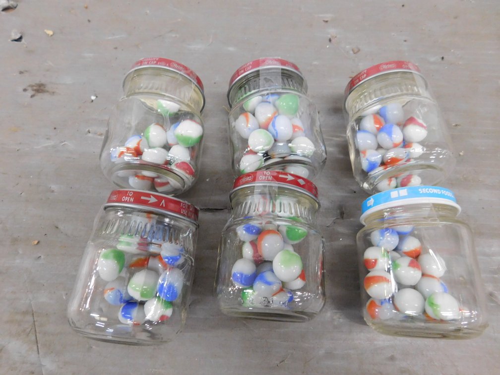 Six Baby Food Jars with Marbles