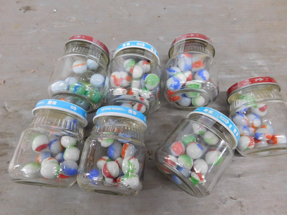Seven Baby Food Jars with Marbles