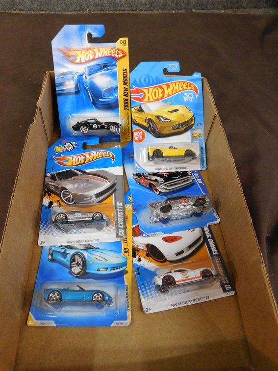 Six Assorted Hot Wheels Die Cast Cars in Sealed Packages
