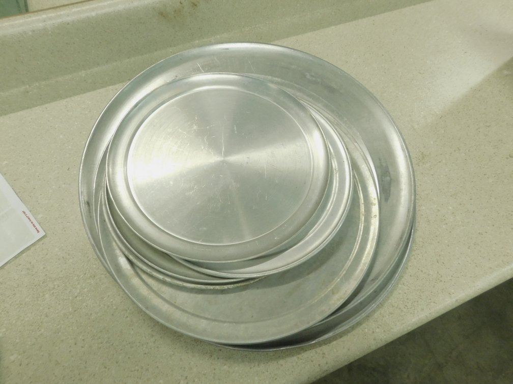 (11) Assorted Pizza Pans Ranges From 12inch to 18inch
