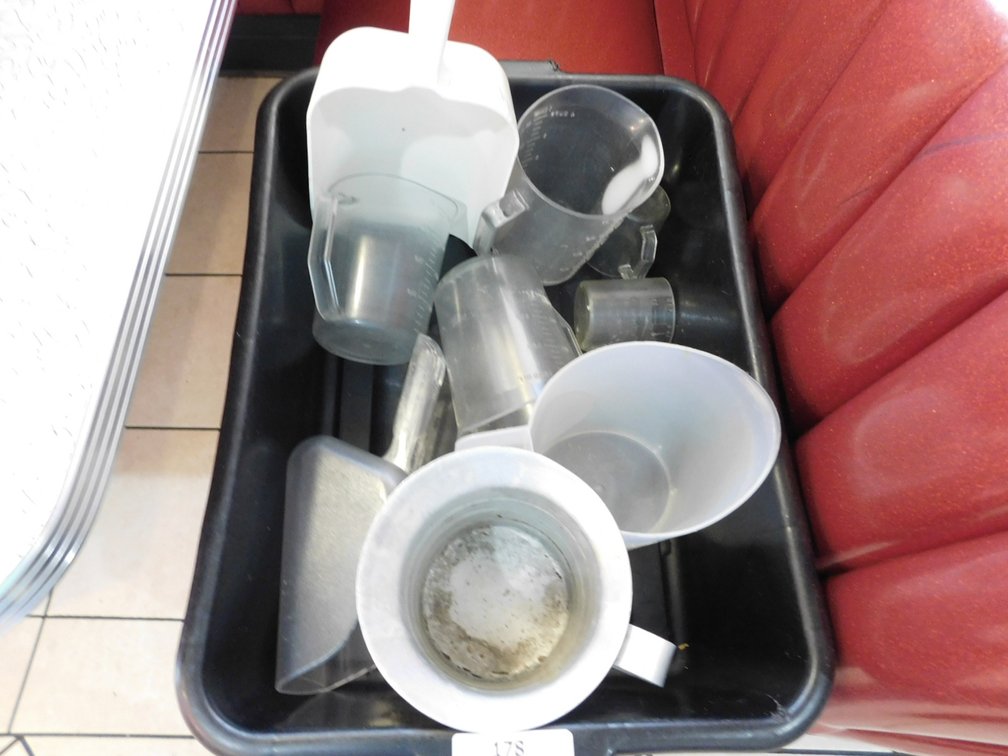Bus Tub of Assorted Measuring Cups and Scoops