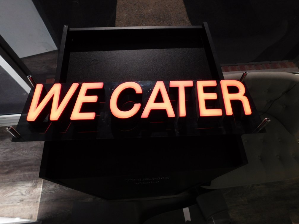 Lighted WE CATER Sign   8" x 27"