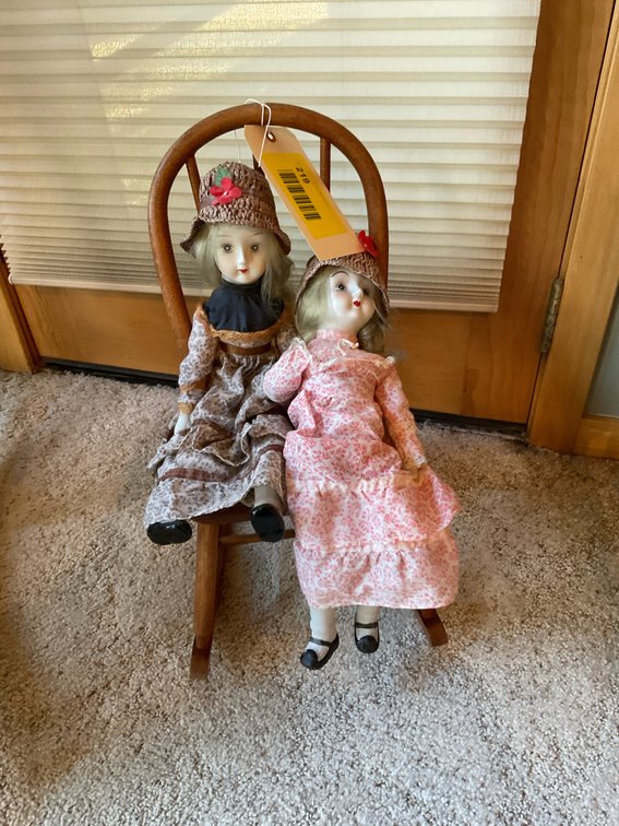 Child's vintage rocking chair with dolls