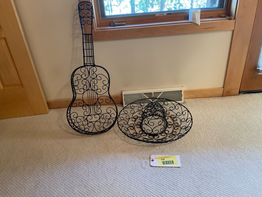 Black iron guitar and sombrero wall art