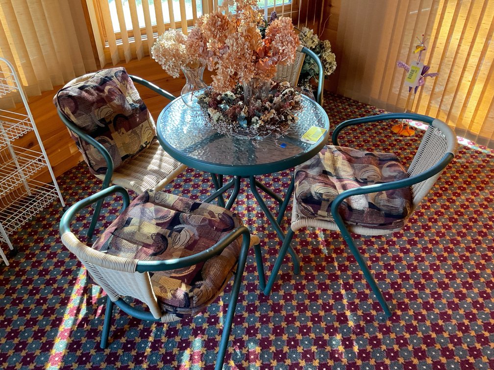 Green patio table with chairs