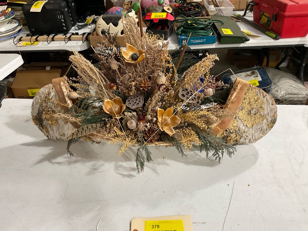 Birch bark canoe with flowers