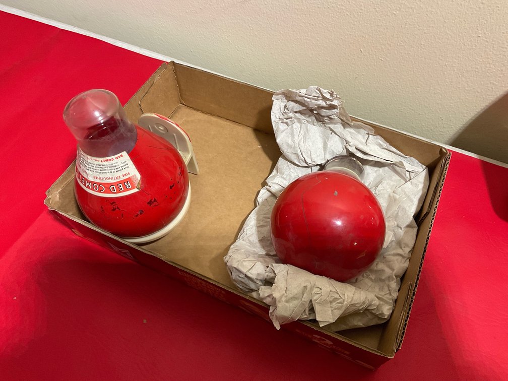 Vintage Red Comet fire extinguishers