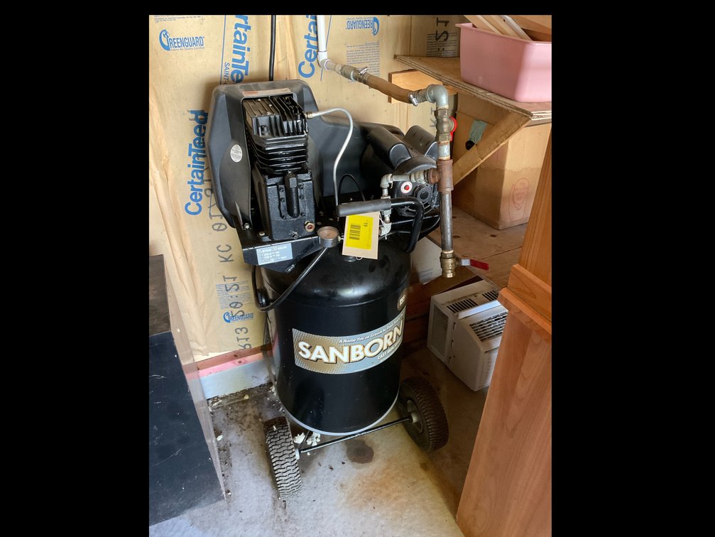 Sanborn upright air compressor